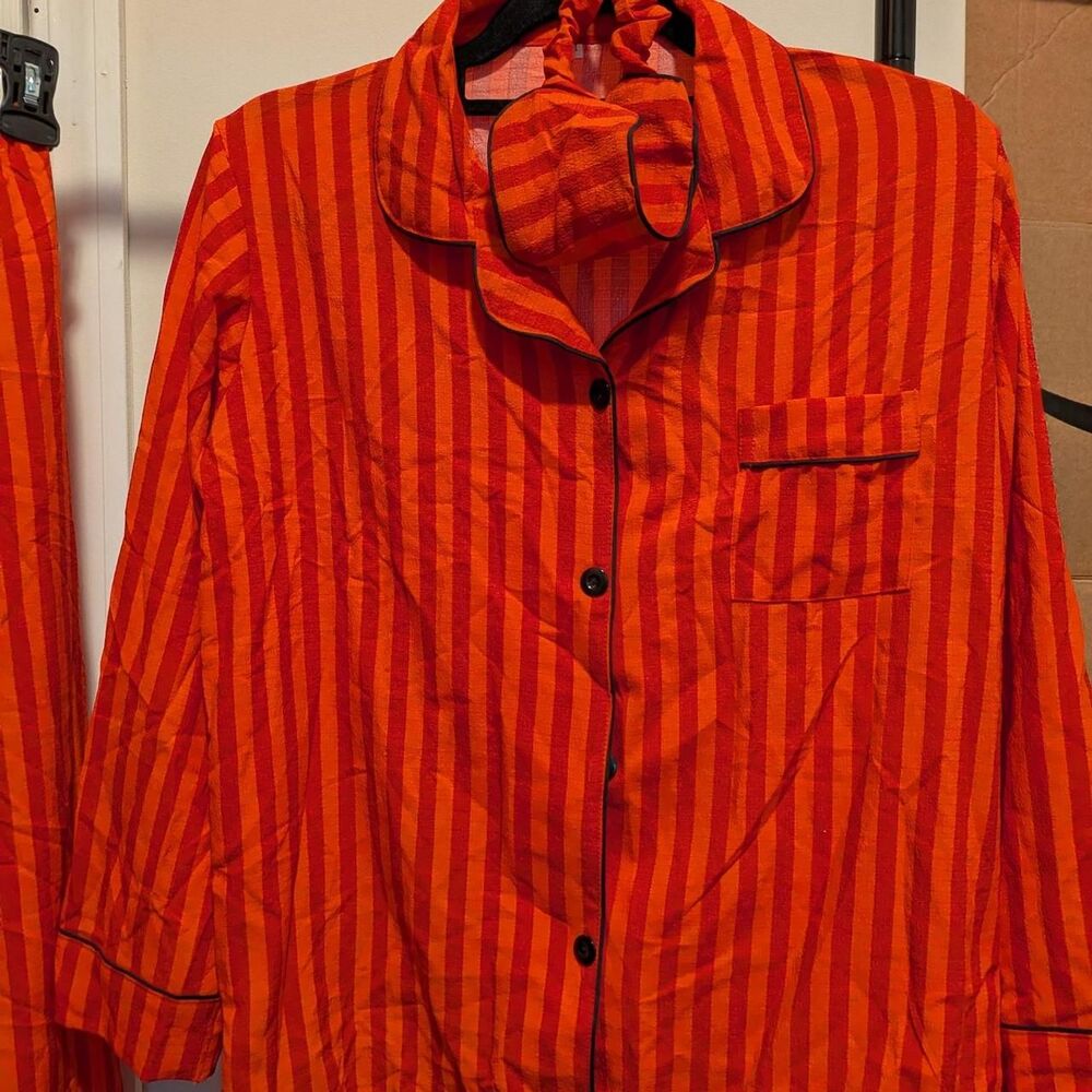 Red and orange striped pajama set with sleep mask